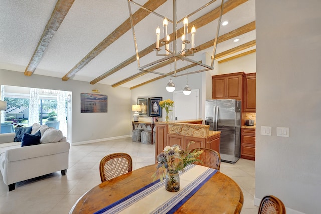 dining space with vaulted ceiling with beams, a notable chandelier, light tile patterned flooring, a textured ceiling, and baseboards