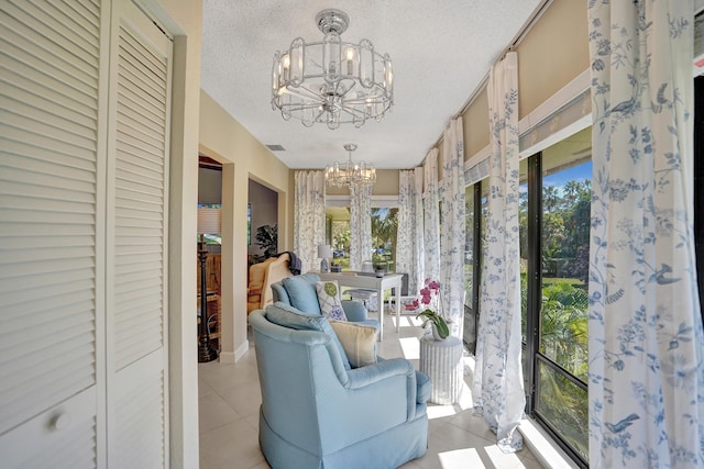 sunroom with a chandelier