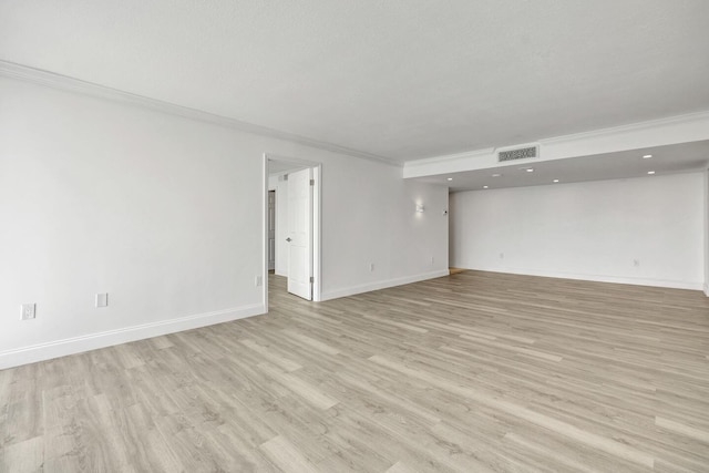 5600 N Flagler Dr Unit 1605, West Palm Beach, FL 33407 - empty room featuring ornamental molding, visible vents, light wood-style floors, and baseboards