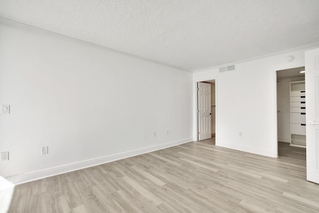5600 N Flagler Dr Unit 1605, West Palm Beach, FL 33407 - unfurnished bedroom featuring light wood-style floors, visible vents, and a textured ceiling