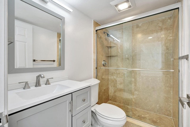 5600 N Flagler Dr Unit 1605, West Palm Beach, FL 33407 - bathroom featuring toilet, a stall shower, visible vents, and vanity