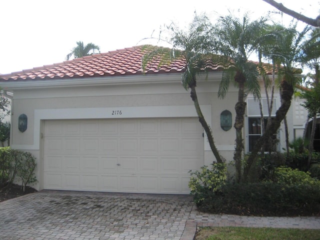 view of side of property with a garage