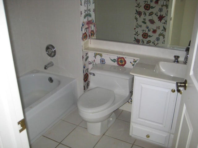 full bathroom featuring tile patterned floors, toilet, vanity, and tub / shower combination