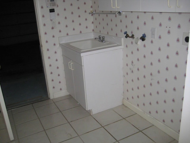 washroom with sink and light tile patterned flooring