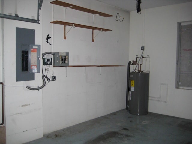 garage featuring water heater and electric panel