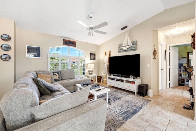 living room featuring vaulted ceiling and ceiling fan