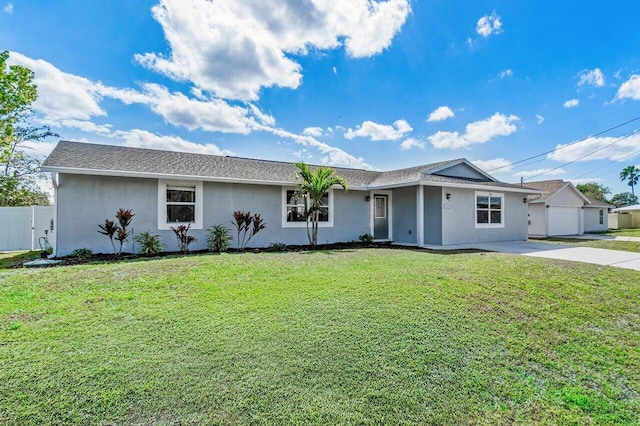 single story home featuring a garage and a front lawn