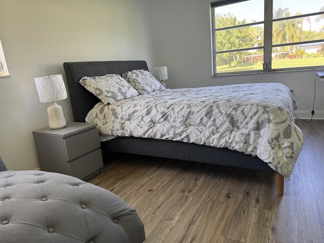 bedroom with wood finished floors