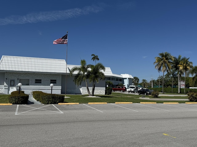 view of property featuring uncovered parking