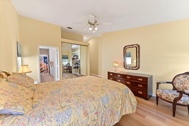 bedroom featuring a closet, visible vents, ceiling fan, and light wood finished floors