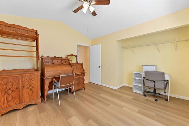 office area with baseboards, a ceiling fan, lofted ceiling, and wood finished floors