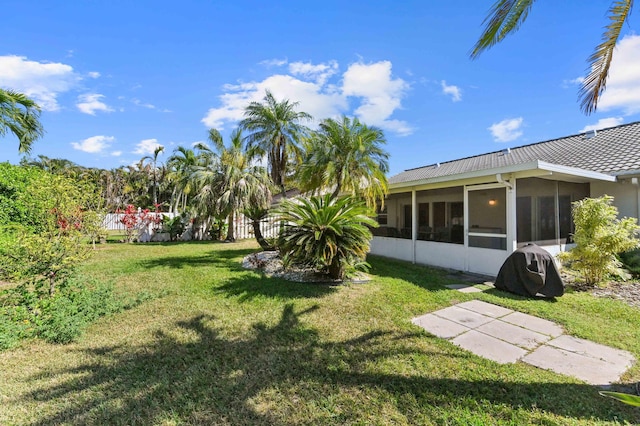 view of yard featuring a sunroom