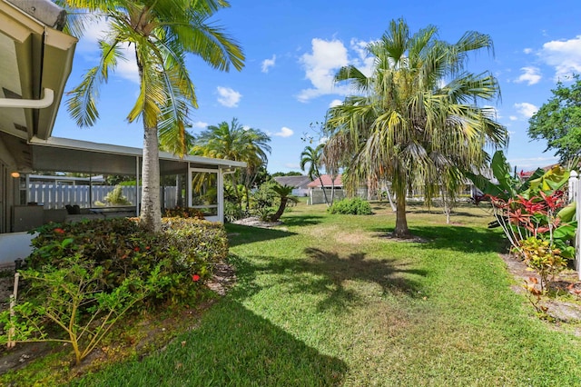 view of yard featuring a sunroom