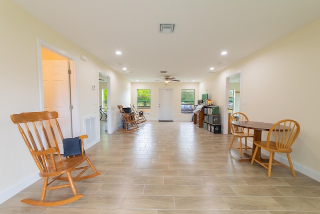 living area featuring ceiling fan