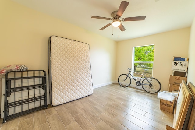 miscellaneous room with light hardwood / wood-style flooring and ceiling fan