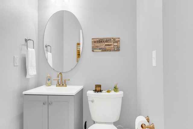 bathroom with toilet and vanity