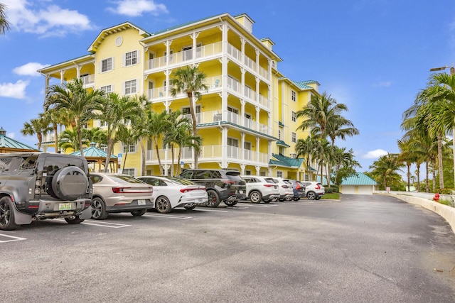 view of building exterior featuring uncovered parking