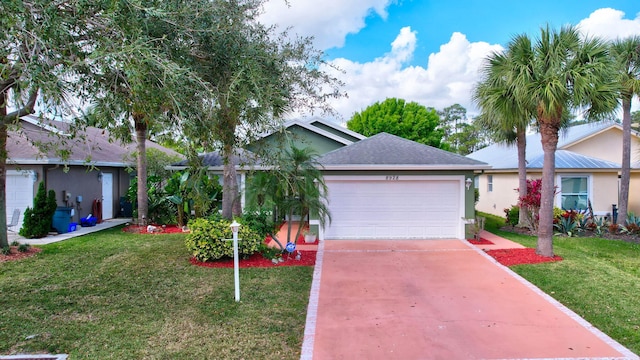 single story home with a front lawn and a garage