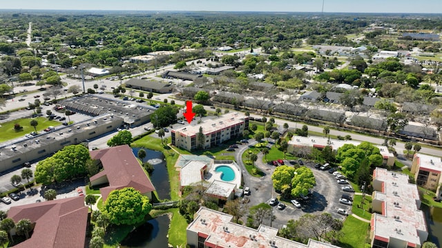 2050 Oleander Blvd Unit 1106, Fort Pierce, FL 34950 - drone / aerial view of a pool area and a nearby body of water