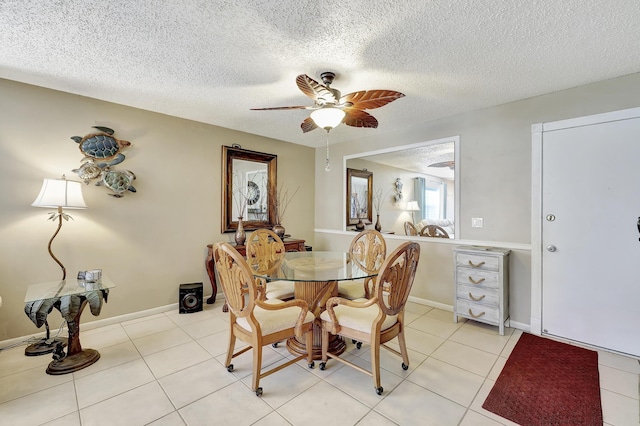 2050 Oleander Blvd Unit 1106, Fort Pierce, FL 34950 - dining space featuring ceiling fan, a textured ceiling, light tile patterned floors, and baseboards