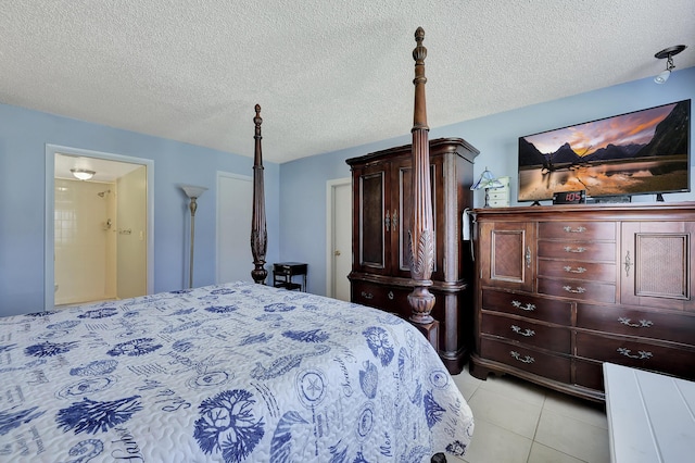 2050 Oleander Blvd Unit 1106, Fort Pierce, FL 34950 - bedroom with light tile patterned floors and a textured ceiling