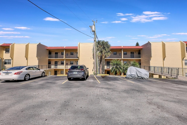 2050 Oleander Blvd Unit 1106, Fort Pierce, FL 34950 - view of property with uncovered parking
