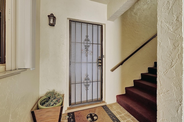 2050 Oleander Blvd Unit 1106, Fort Pierce, FL 34950 - entryway with a textured wall and stairs