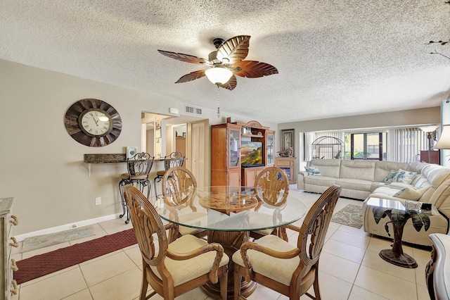 2050 Oleander Blvd Unit 1106, Fort Pierce, FL 34950 - dining room featuring light tile patterned floors, a ceiling fan, and a textured ceiling