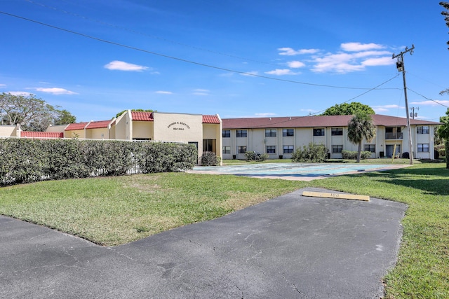 2050 Oleander Blvd Unit 1106, Fort Pierce, FL 34950 - view of building exterior featuring uncovered parking
