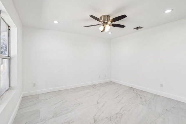 spare room with ceiling fan