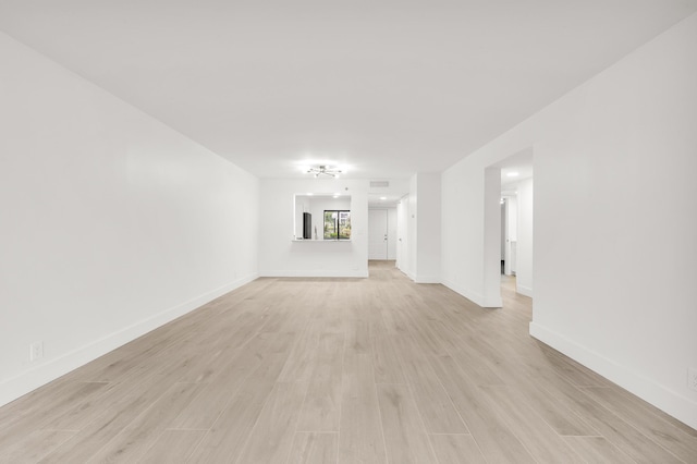 unfurnished living room featuring light wood-type flooring