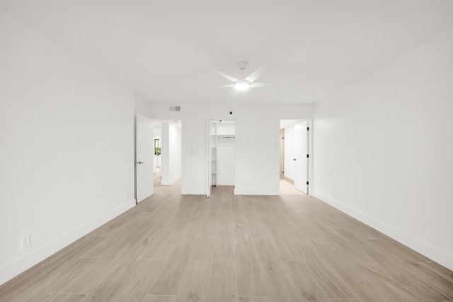 interior space with ceiling fan and light hardwood / wood-style floors