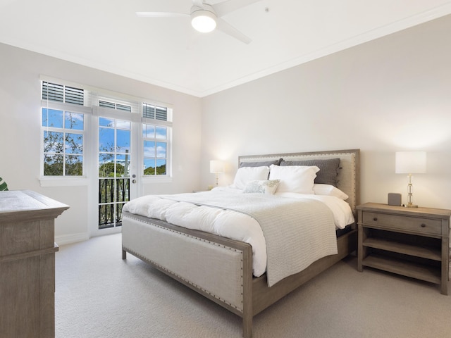 bedroom with access to exterior, ornamental molding, light carpet, ceiling fan, and baseboards