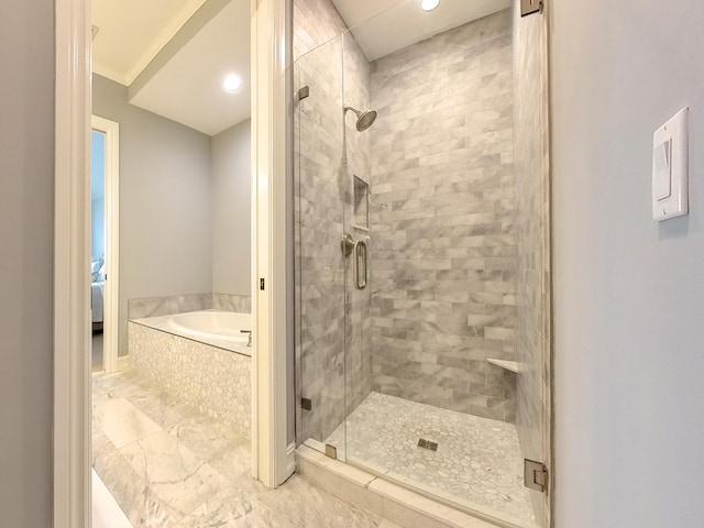 full bath featuring a shower stall and a bath