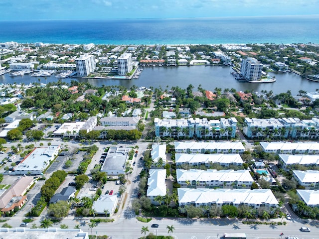 bird's eye view featuring a water view and a city view