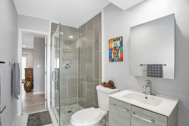 2144 NE 63rd St, Fort Lauderdale, FL 33308 - bathroom featuring tile patterned flooring, toilet, vanity, baseboards, and a stall shower
