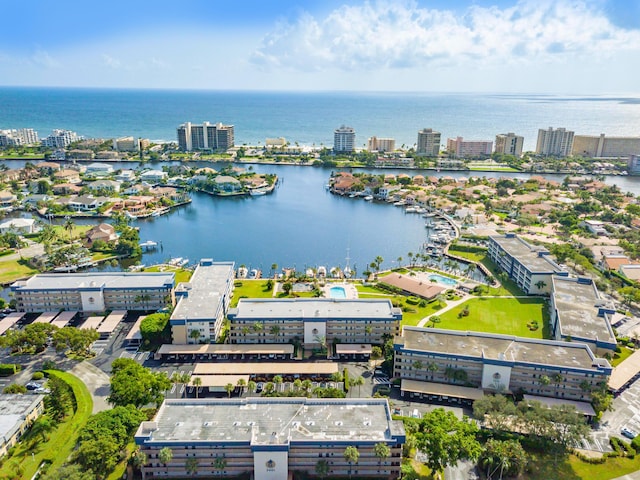 birds eye view of property featuring a water view and a city view