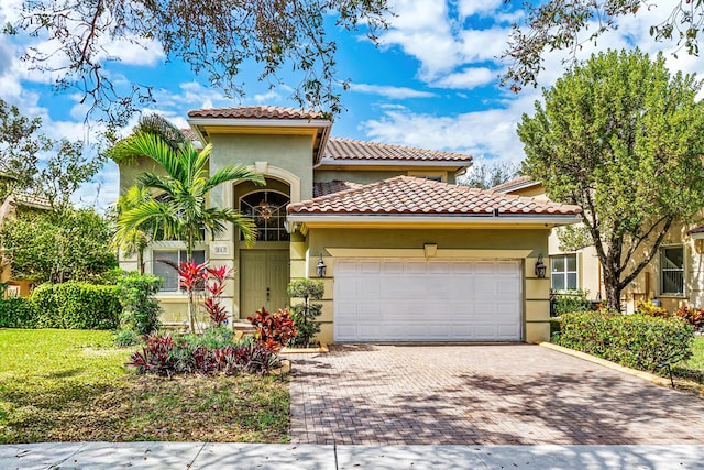 mediterranean / spanish-style home featuring a garage