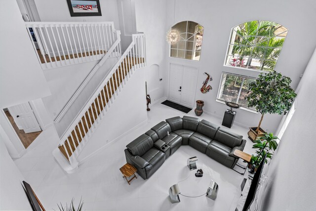 853 Gazetta Way, West Palm Beach, FL 33413 - living room with a towering ceiling and baseboards