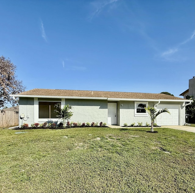 single story home featuring a garage, fence, a front lawn, and stucco siding