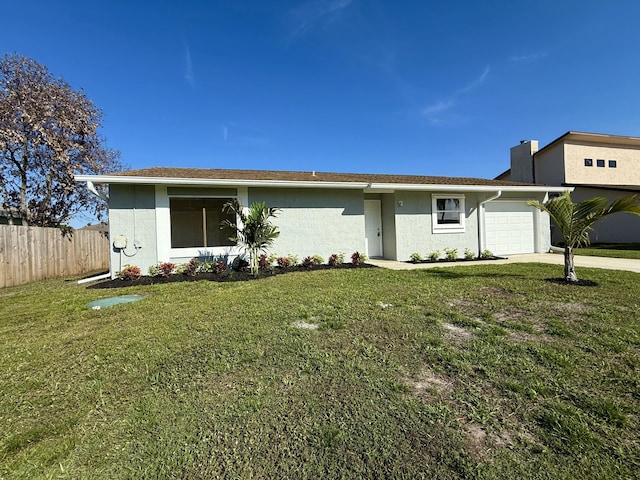 ranch-style house with a garage, driveway, fence, a front lawn, and stucco siding