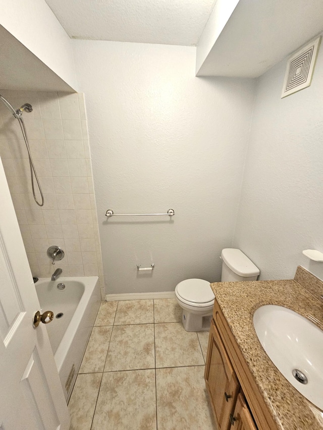 full bathroom with visible vents, toilet, tile patterned floors, vanity, and washtub / shower combination