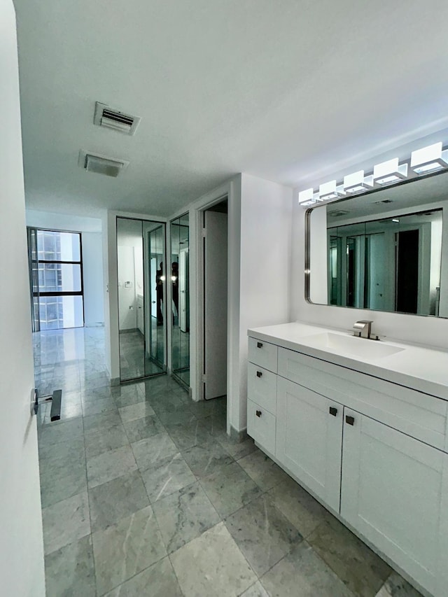 bathroom featuring visible vents and vanity