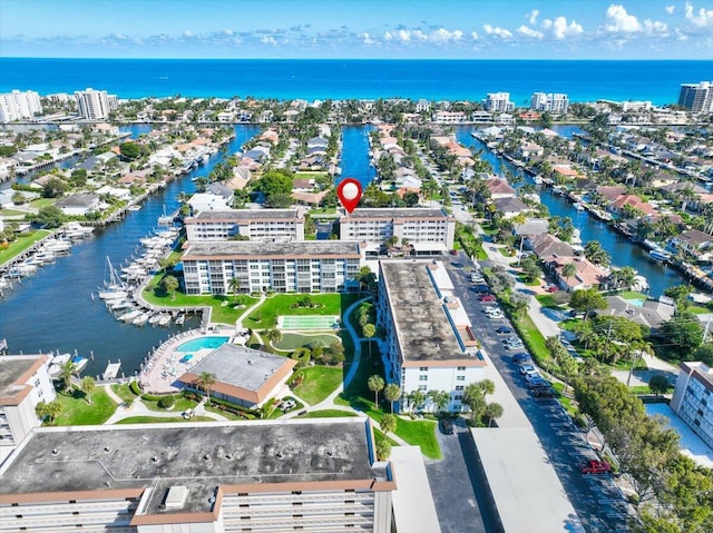 birds eye view of property featuring a water view