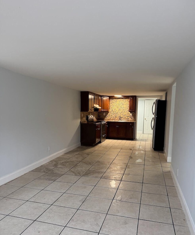 interior space featuring light tile patterned floors and sink