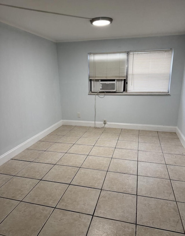 tiled spare room featuring cooling unit