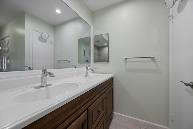 10137 S 42nd Ave S, Boynton Beach, FL 33436 - full bath featuring wood finished floors, baseboards, a sink, and double vanity