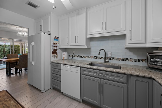 kitchen featuring gray cabinets, sink, white appliances, and white cabinets