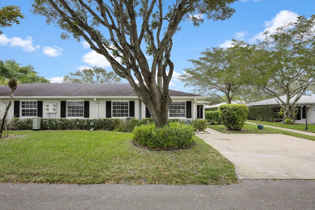 10137 S 42nd Ave S, Boynton Beach, FL 33436 - ranch-style home with brick siding and a front yard