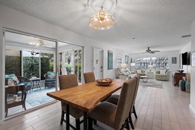 10137 S 42nd Ave S, Boynton Beach, FL 33436 - dining space with wood finished floors, a textured ceiling, ceiling fan, and visible vents